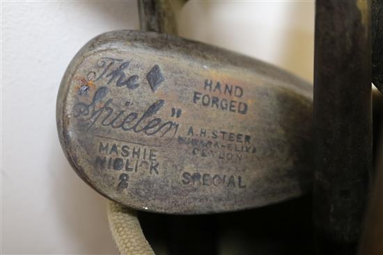 Two wooden drivers by Armstrong & Co and Paxton, a gun metal putto signed Jacques, 7 other and a golf ball